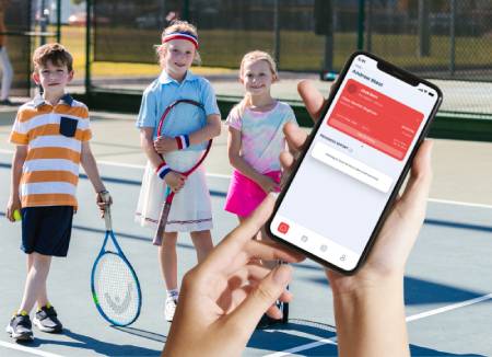 First Class app for tennis lesson scheduling being used on court