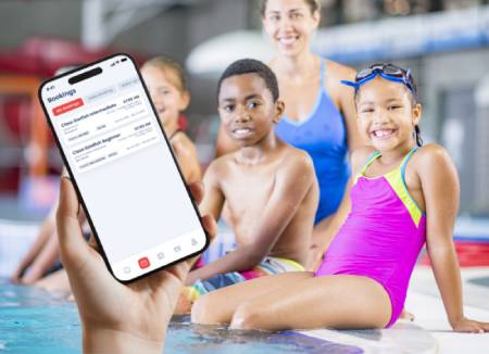 group of kids taking swimming lessons